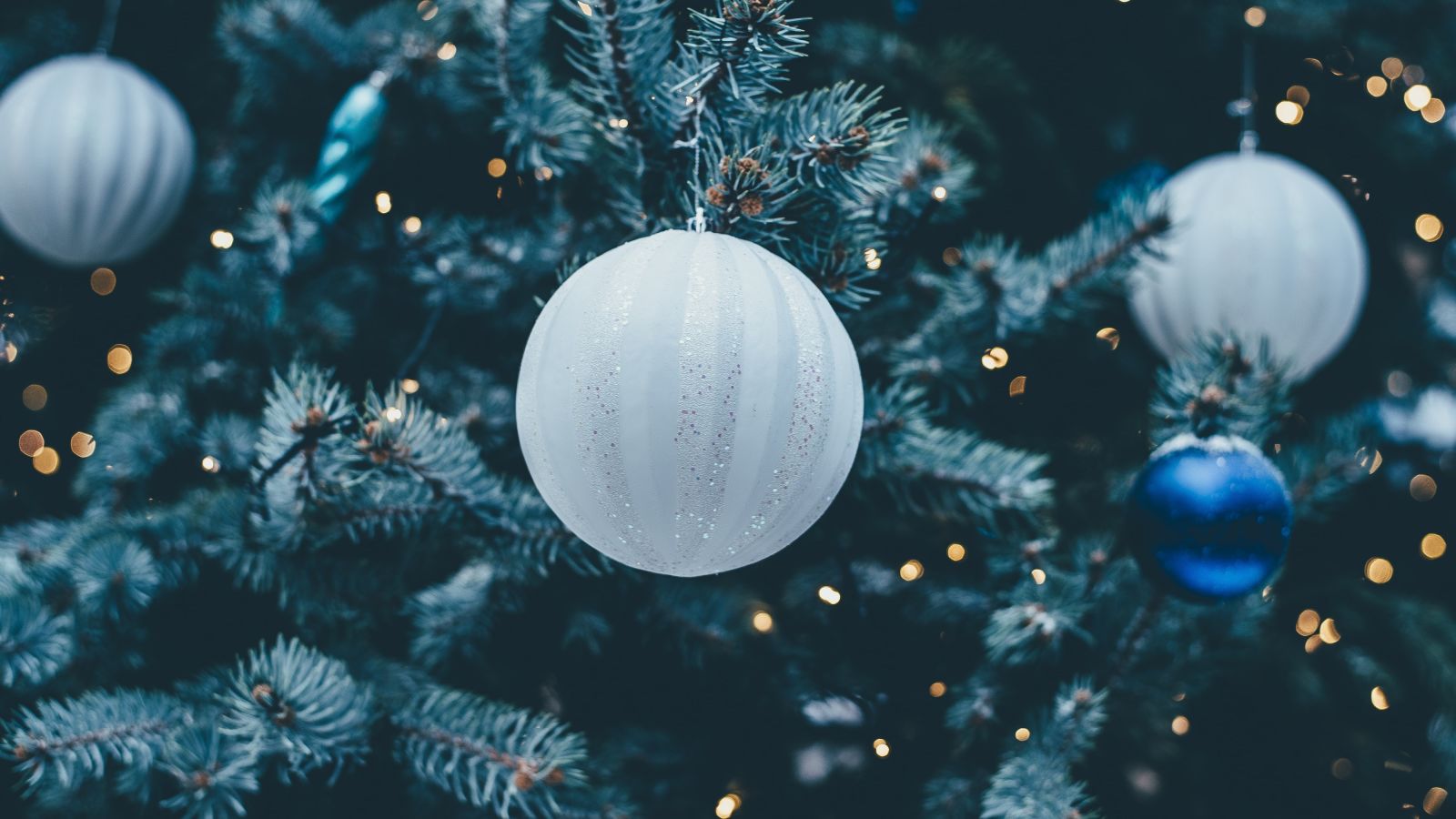 ornaments decked up on a christmas tree with led lights 