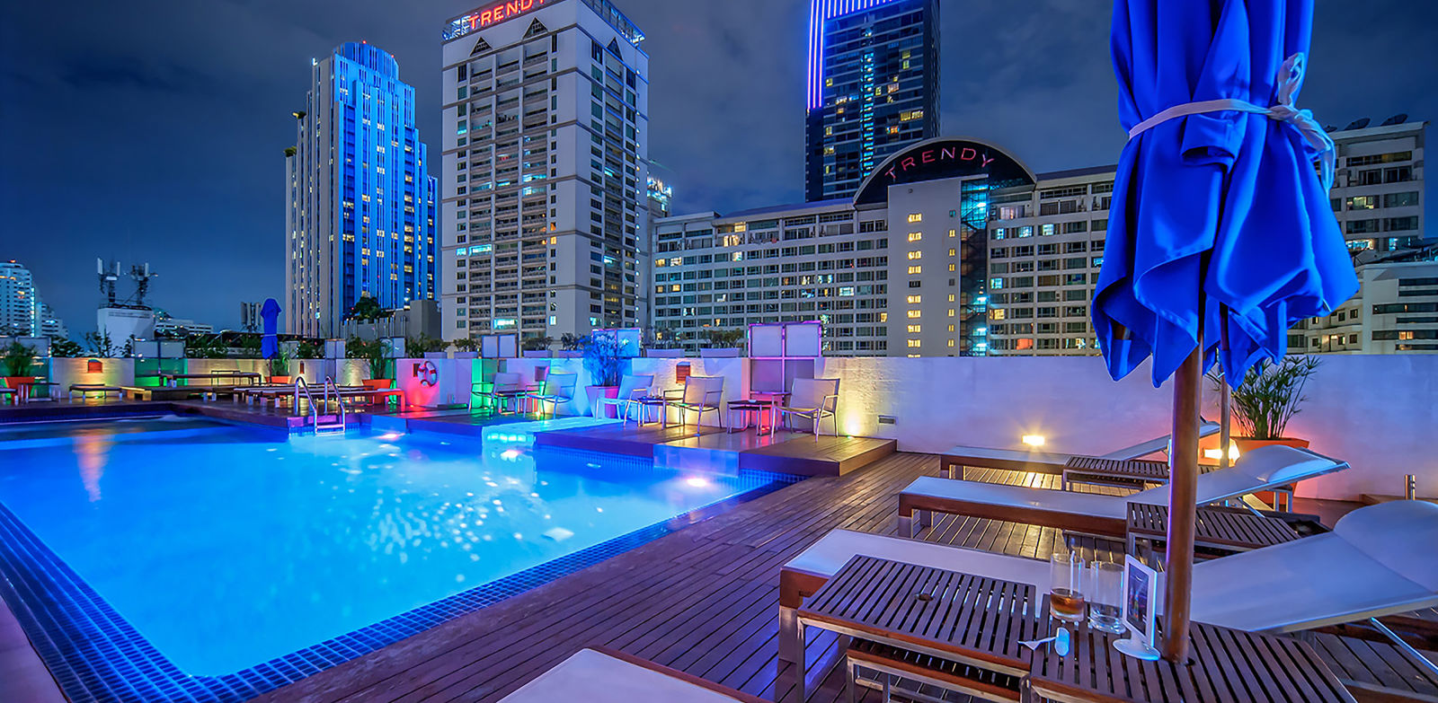 Rooftop swimming pool area at night