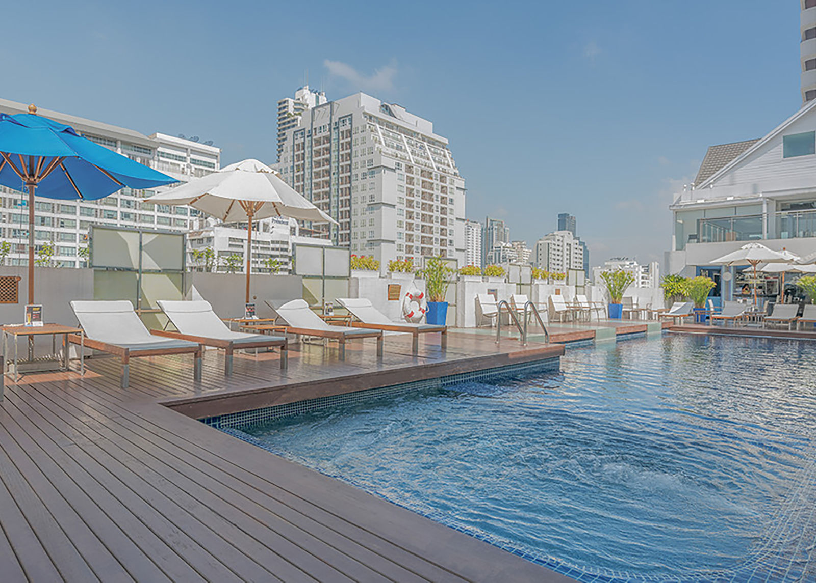 the rooftop swimming pool area during daytime.jpg