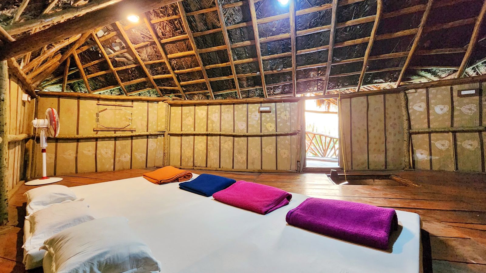 A view of the comfortable beds under a wooden ceiling in the Family Wooden Cottage - Evergreen County