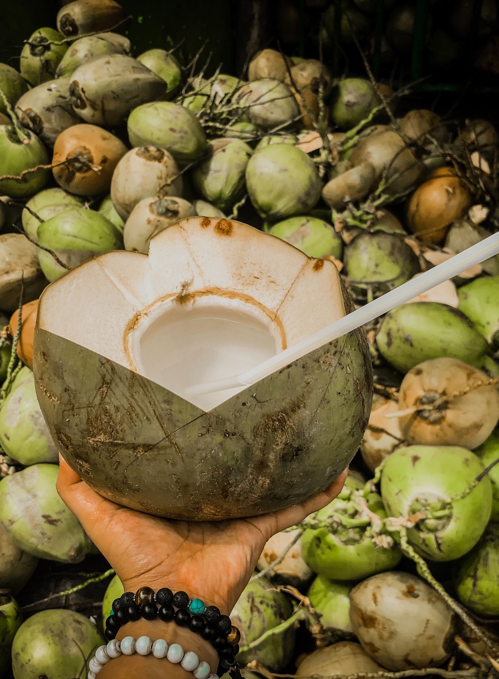 a person holding a tender coconut