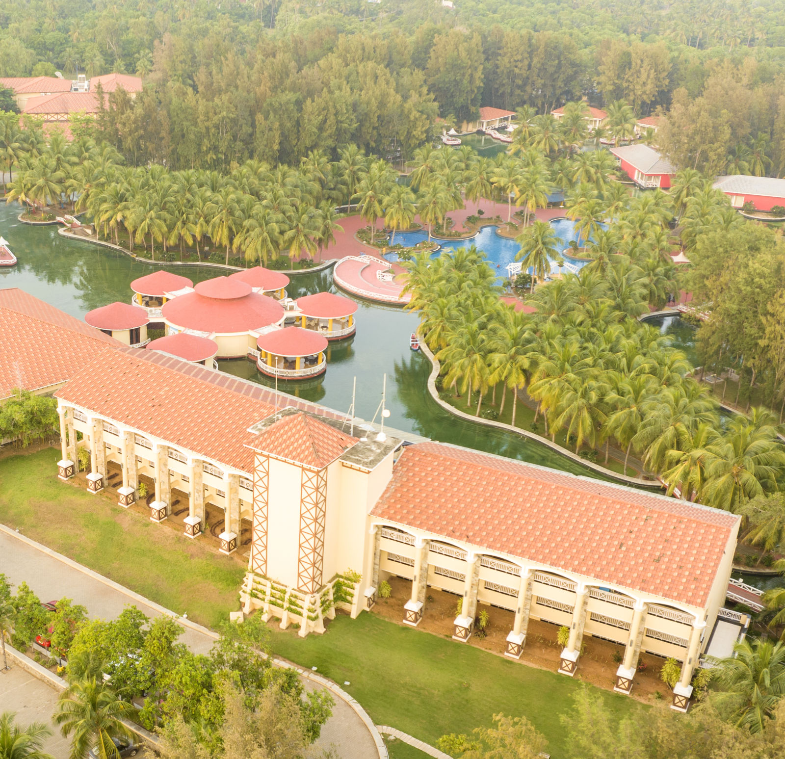 Aerial Resort View of Ocean Spray, Puducherry covered by trees and greenery