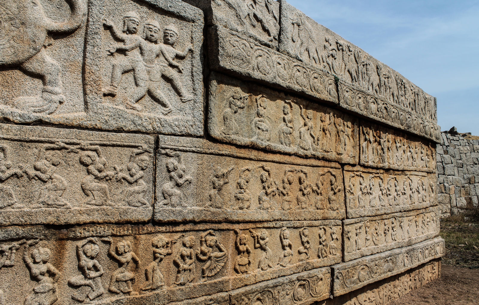 Carvings of dancing girls on the walls of the Mahanavami Dibba