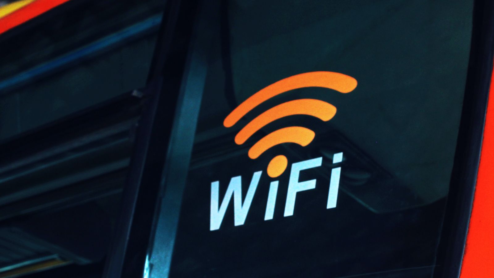 A wi-fi symbol with the words wifi on a bus placed on a plastic exterior