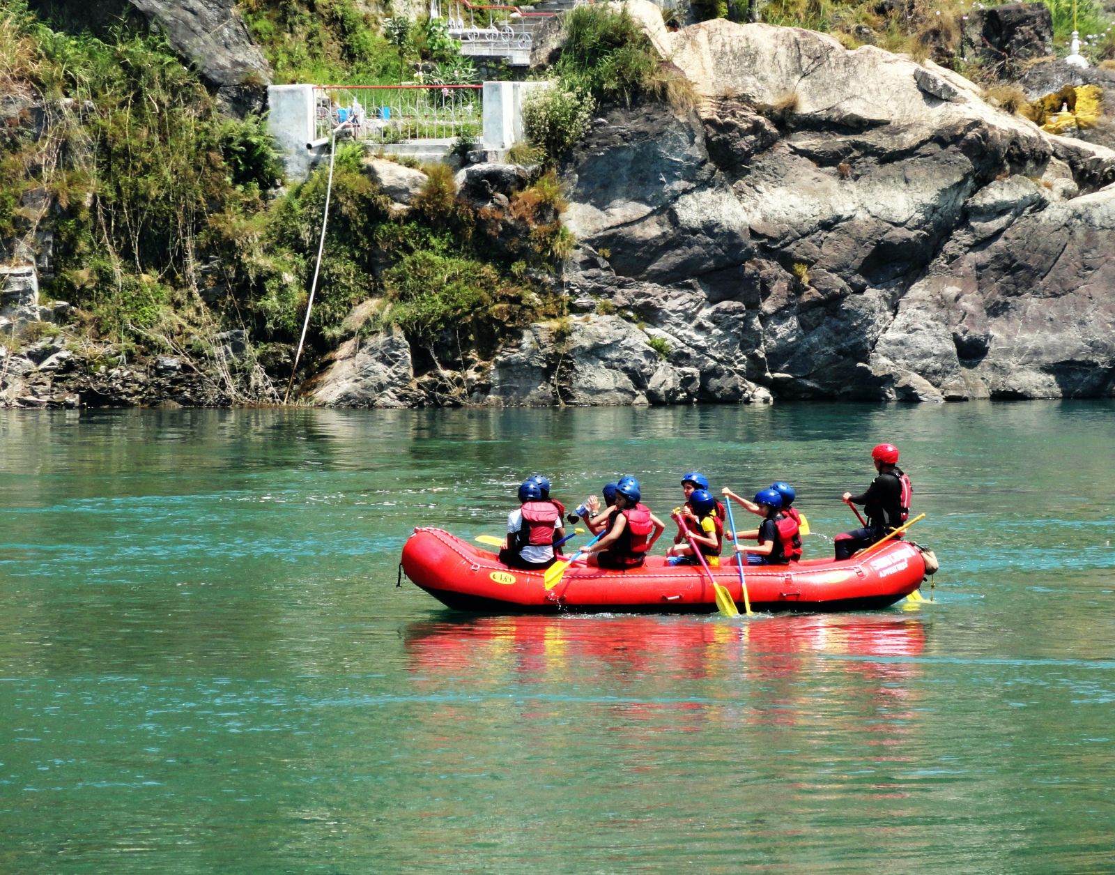 a group of people rafting on a river