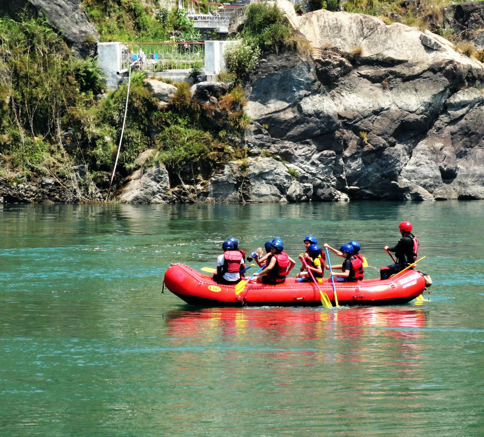 a group of people rafting on a river