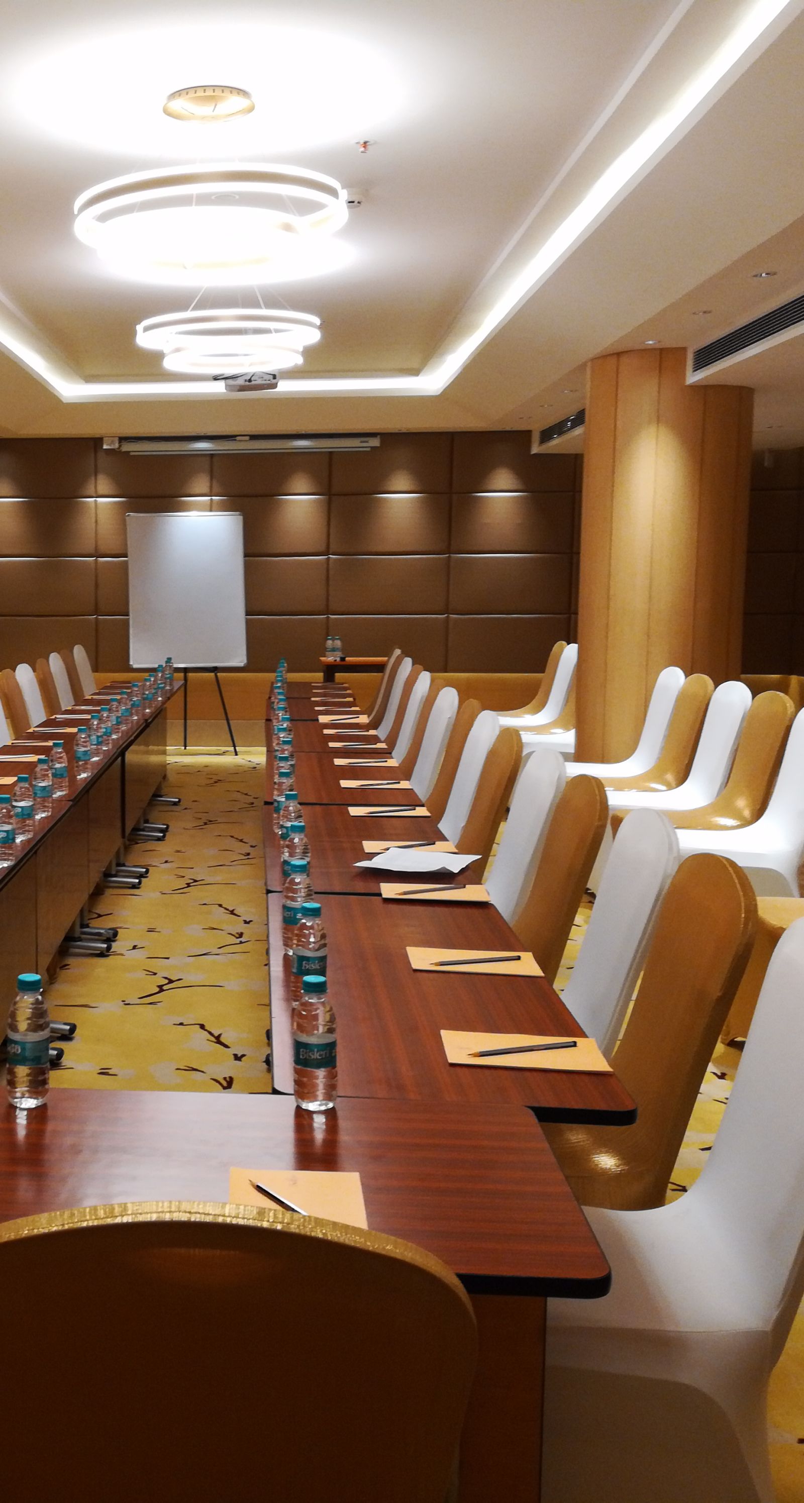 a meeting hall with a long rectangular table with chairs surrounding it - Hotel Fountain Tree By TGI - JP Nagar, Bangalore