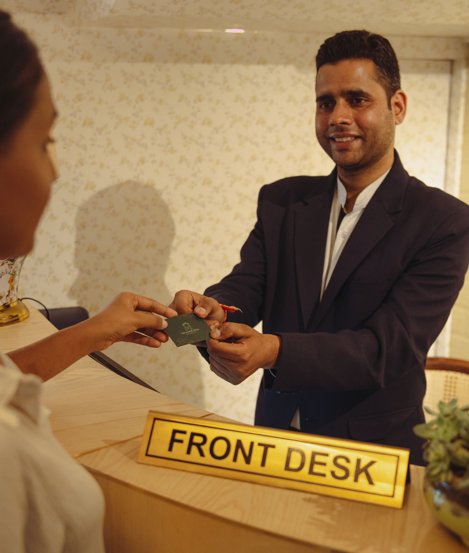 Photo of the front desk giving keys to the guest . Place is The Manor House Hotel Rajpur road dehradun.