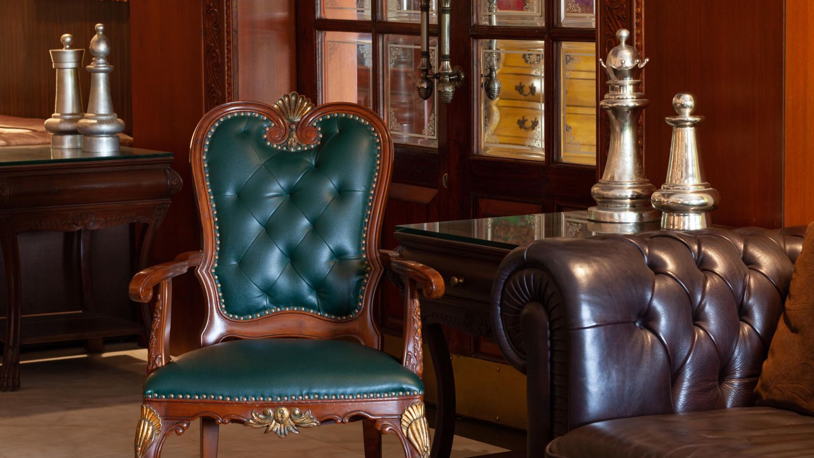 a royal chair by a table filled with antiques - Mayfair Palm Beach Resort, Gopalpur-on-Sea