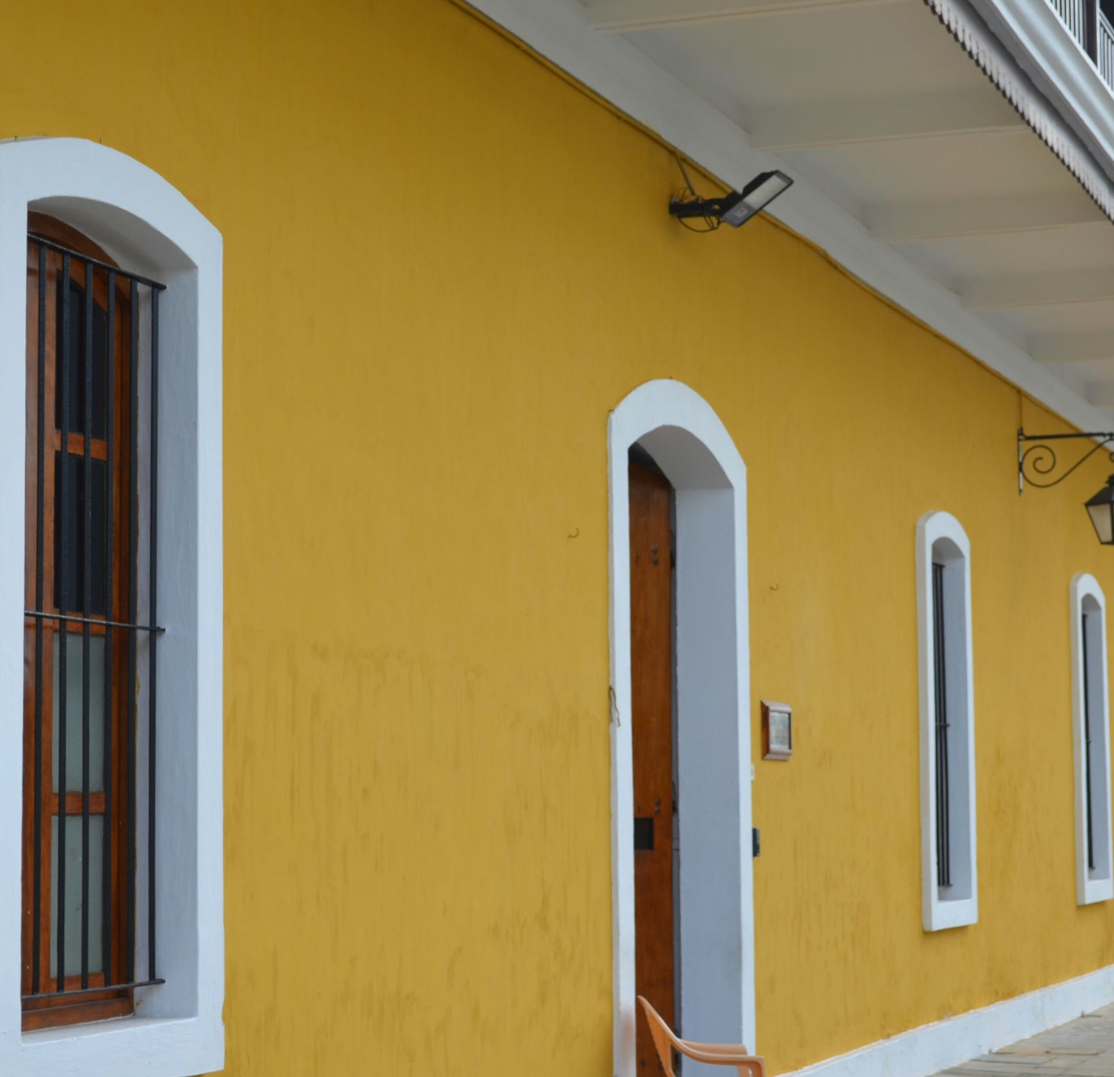 An overview of a building with yellow coloured outer walls in Pondicherry