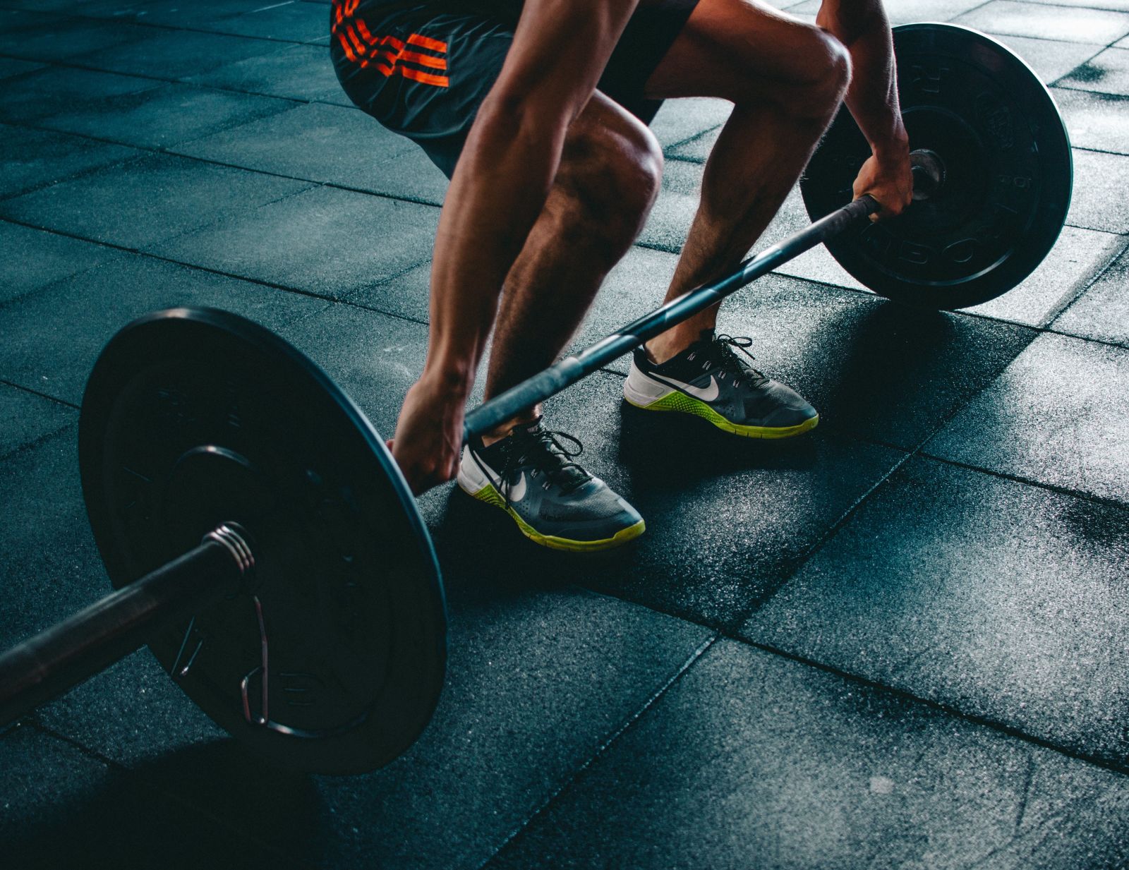 A man lifting weights at the gym