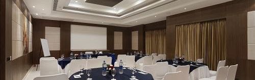 The Senate Banquet Hall with round tables and seating arranged aesthetically for the event at Inde Signature Tower, Gurgaon