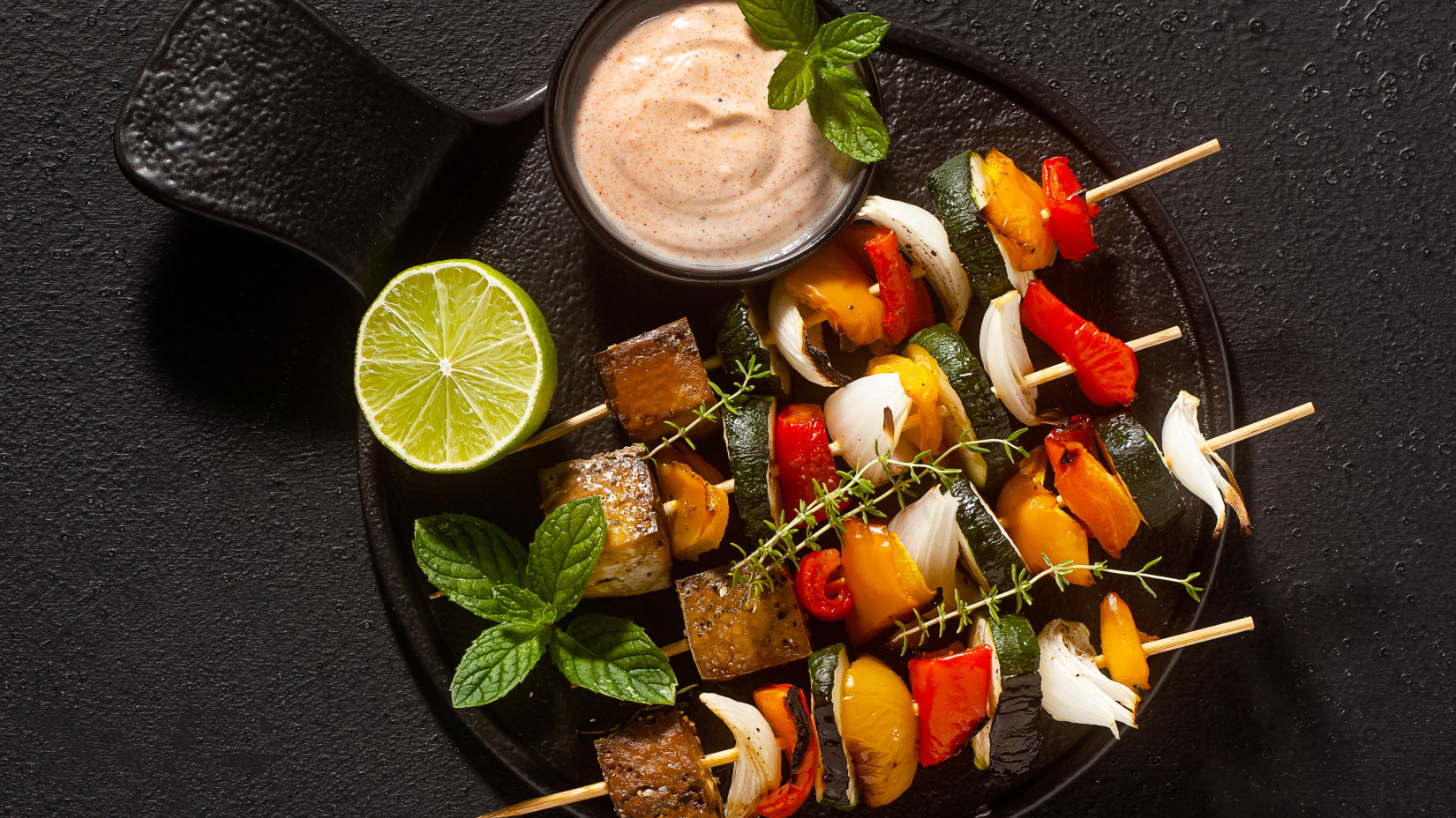 Vegan kebabs vegetables smoked tofu with cashew sauce smoked paprika black