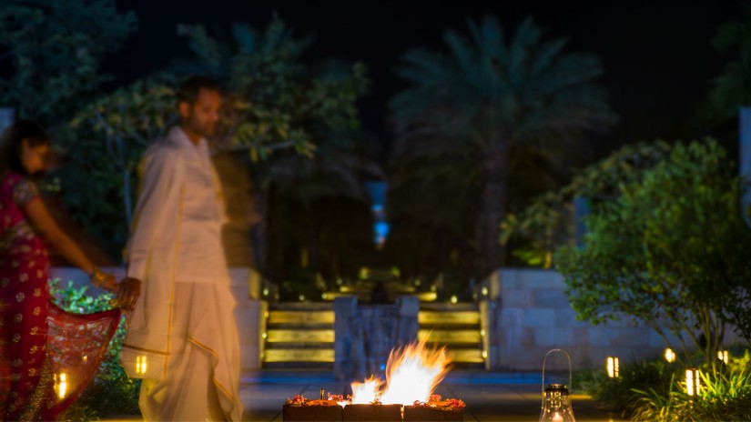 a newlywed couple performing wedding rituals