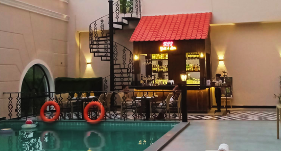 alt-text swimming pool and poolside dining area  - Hotel Polo Towers, Agartala