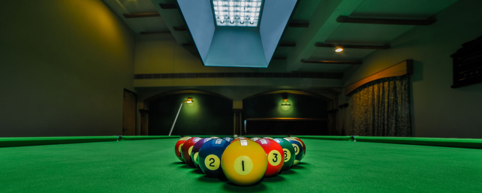 pool table with billiards ball placed on the table at Hotel Tara, Hyderabad