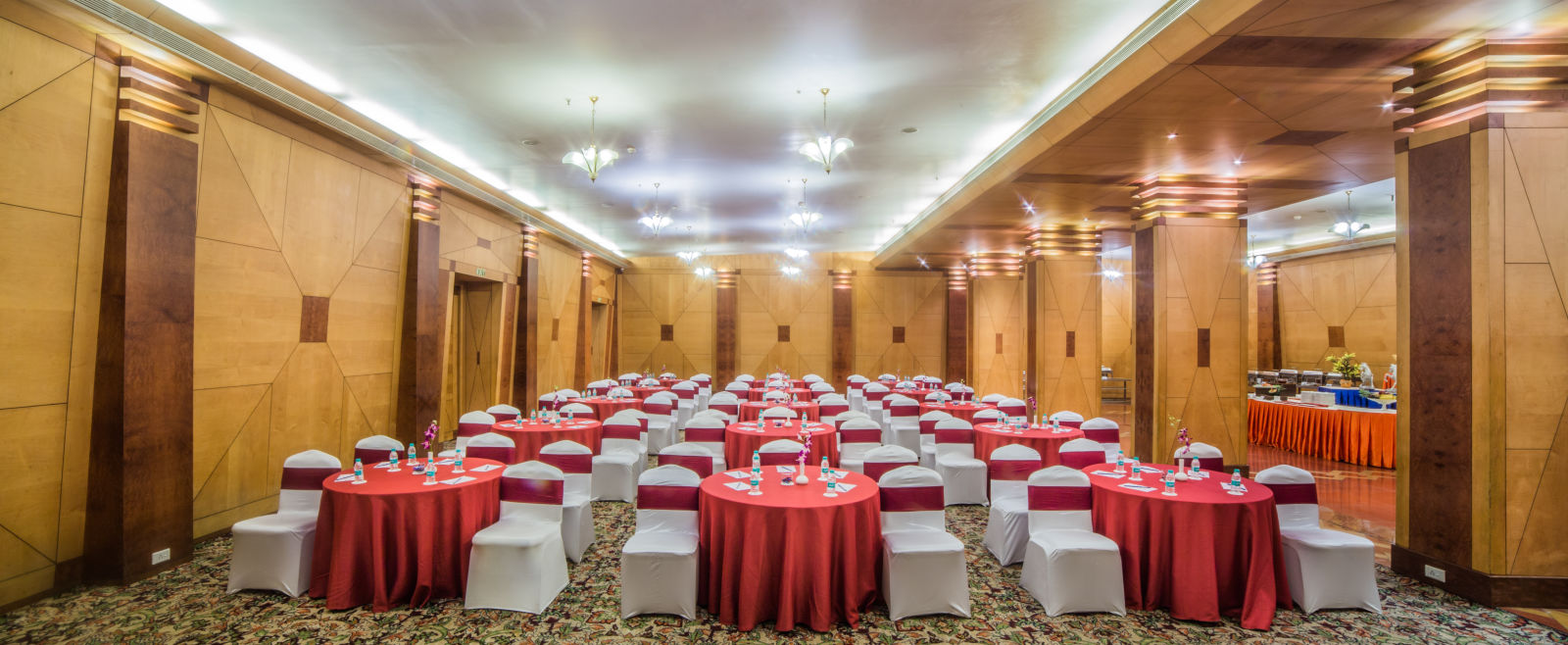 Seating arrangement in Mayfair Hall at Sitara Luxury Hotel
