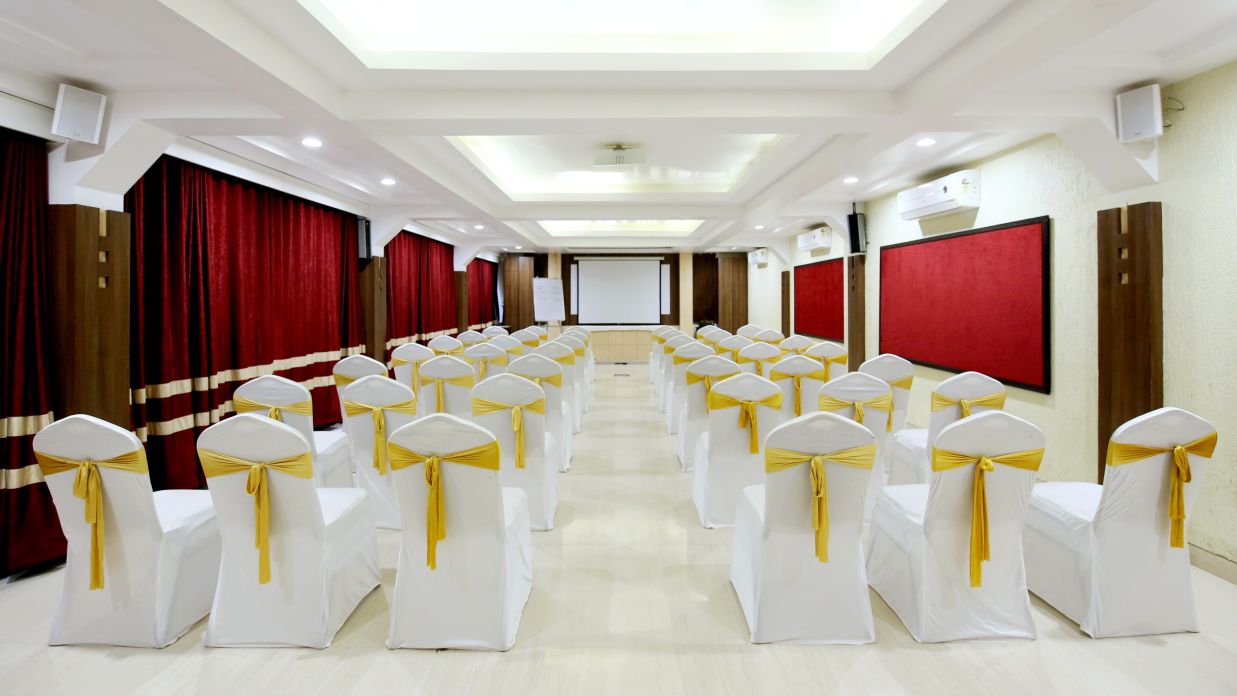 the indoor seating space at the banquet hall in Khandala - Zara's Resort 0