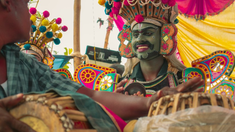 People dancing in costume during a festival