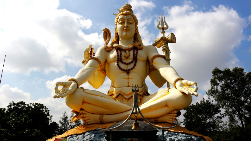 an image shot from a lower angle that captures a statue of Shiva