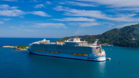 a white cruise floating in the middle of an ocean