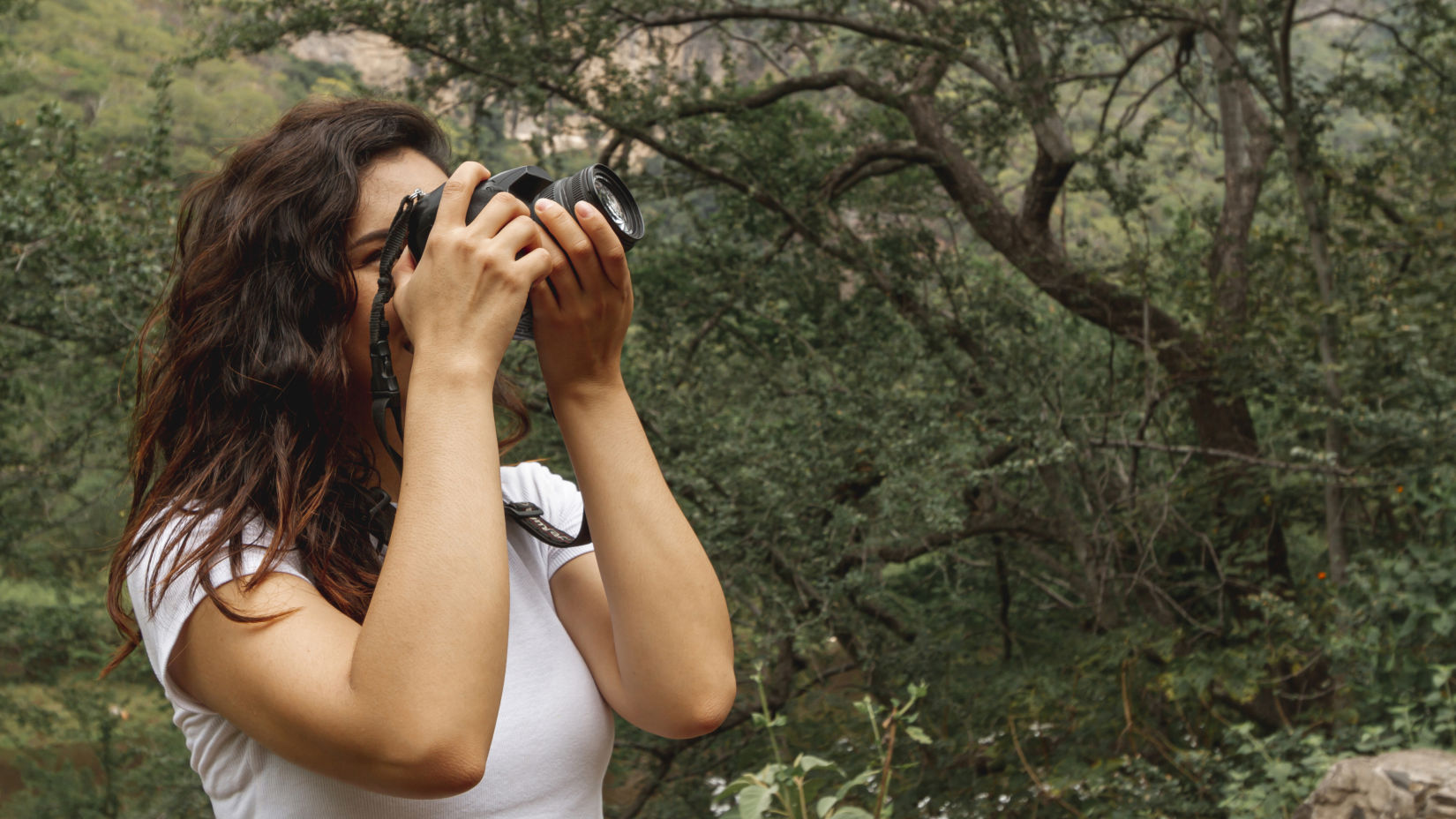 side-view-woman-taking-photos-nature