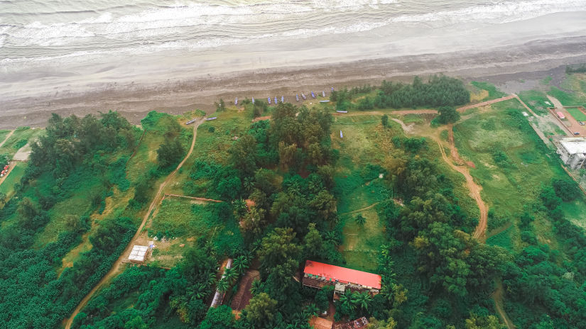 aerial view of lotus eco beach resort next to the beach