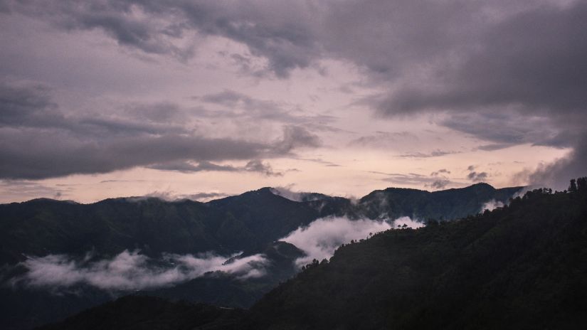 View of mountains with clouds passing by