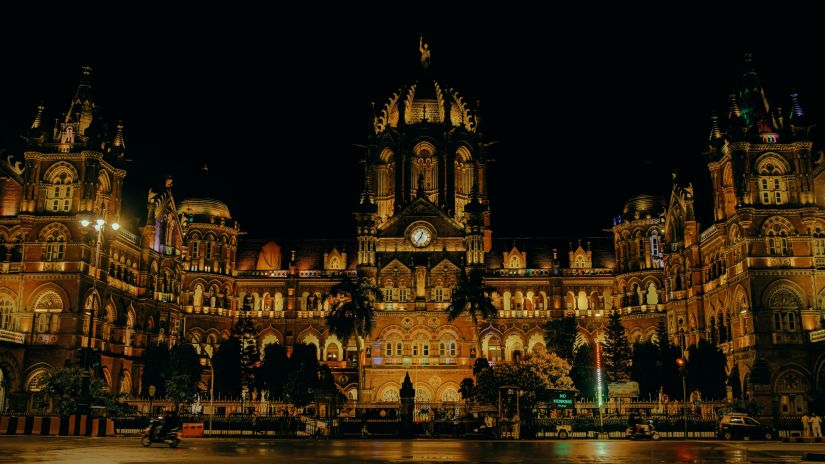 Illuminated Historical Building on Night Street