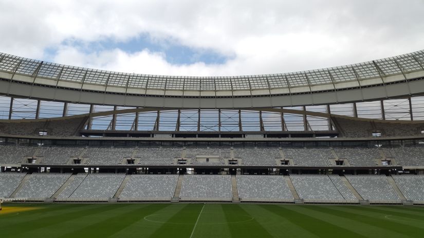 An overview of a cricket stadium and the seating