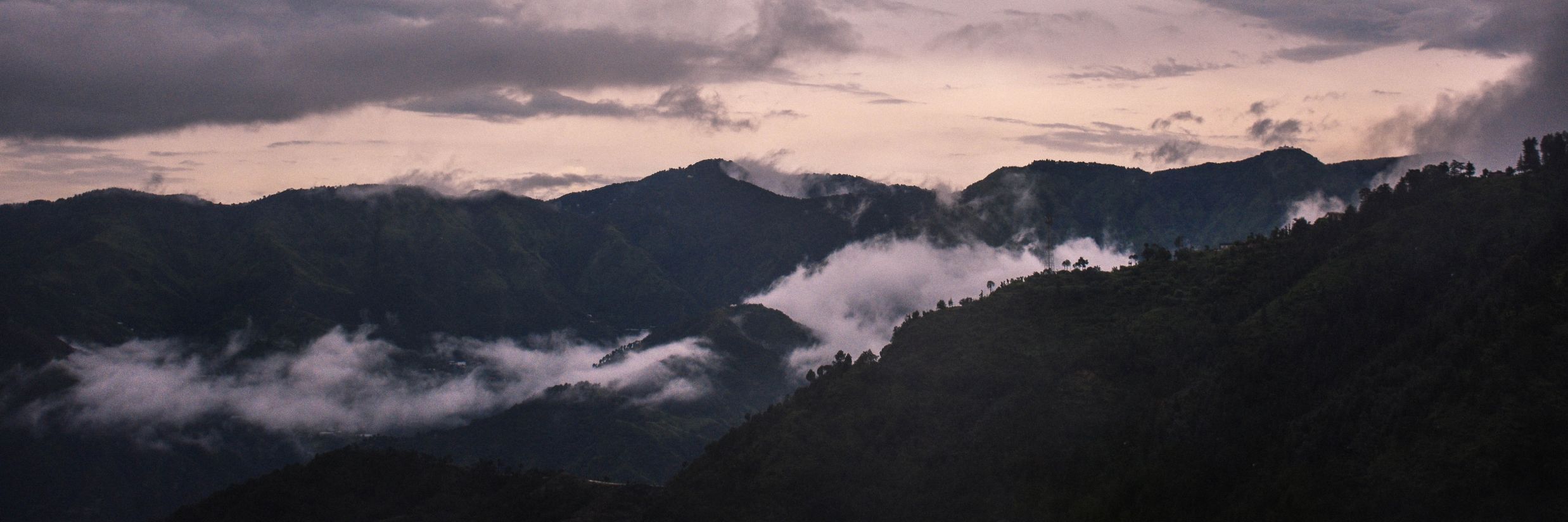 View of mountains with clouds passing by