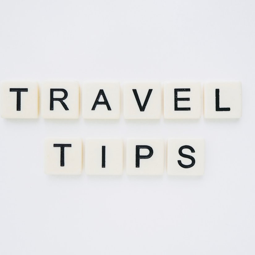 travel tips made out from scrabble tiles and places on a table