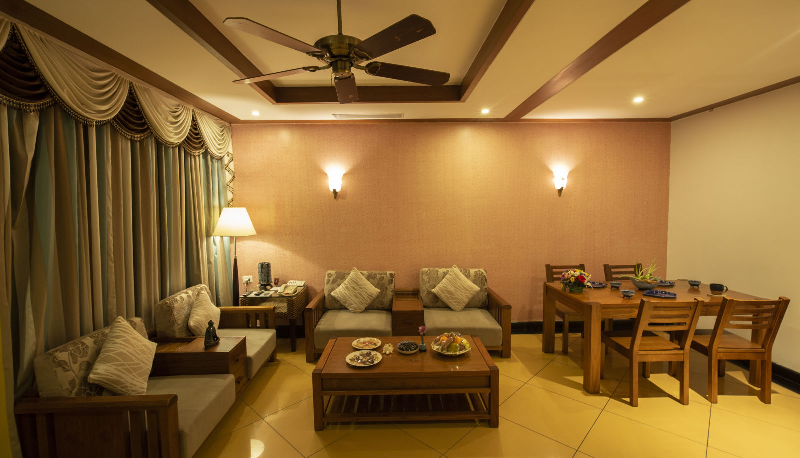 Royal Villa TAHITI Living Room with sofas and a dining table at Ocean Spray Puducherry