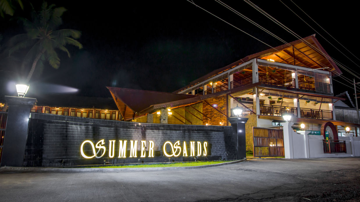 Resort facade with the text Summer Sands written on its walls - Symphony Summer Sand Beach Resort And Spa, Neil Island