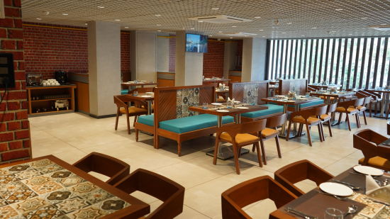 Restaurant space at Purple Beds by VITS, Surat 