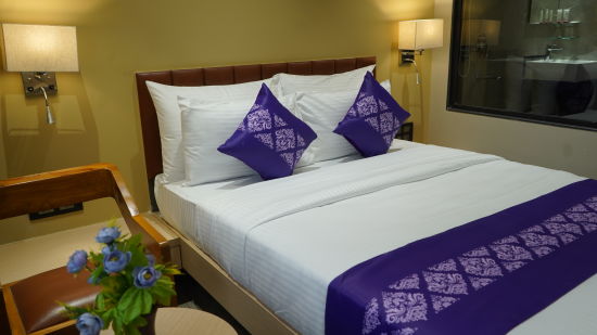 Room at Purple Beds by VITS, Surat with a seating space