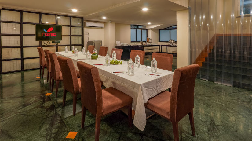 Restaurant with brown dining chairs and glasses on table