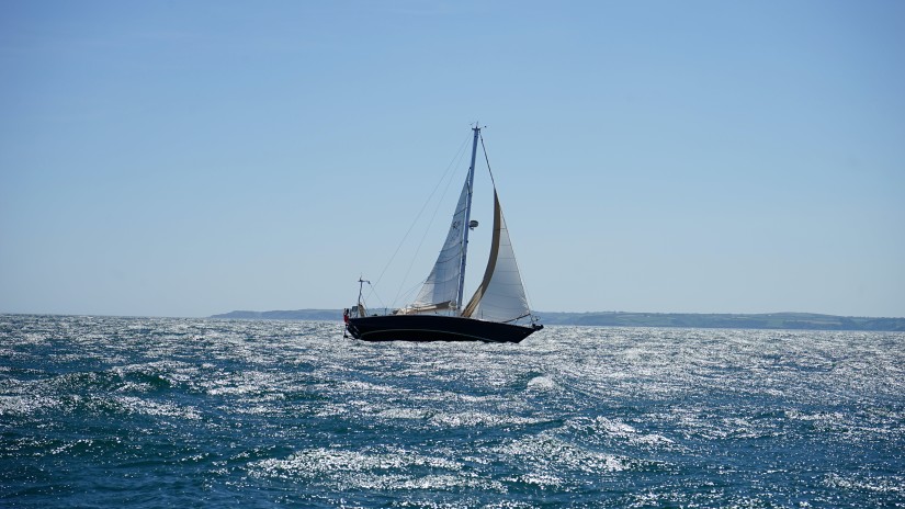 A long shot of a boat in the sea 