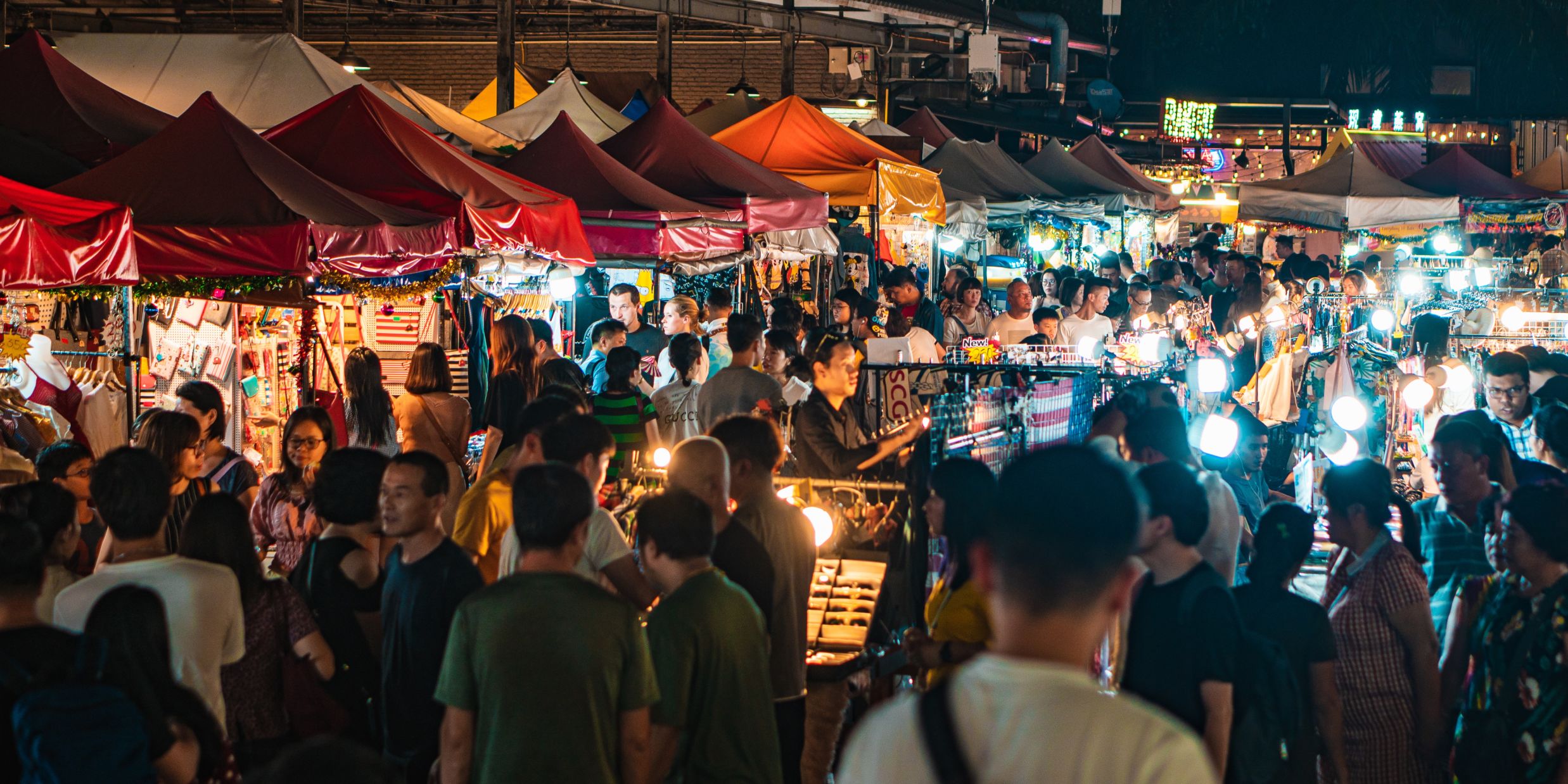 People exploring a night market