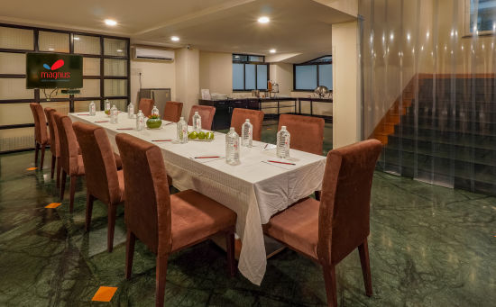 alt-text Restaurant with brown dining chairs and glasses on table