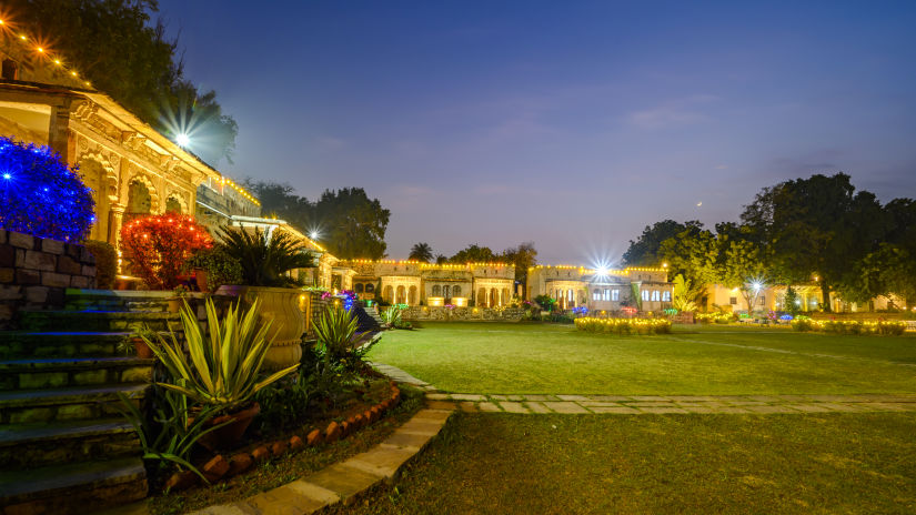 Deo Bagh - 17th Century, Gwalior - the garden area with lights on at the Gwalior resort