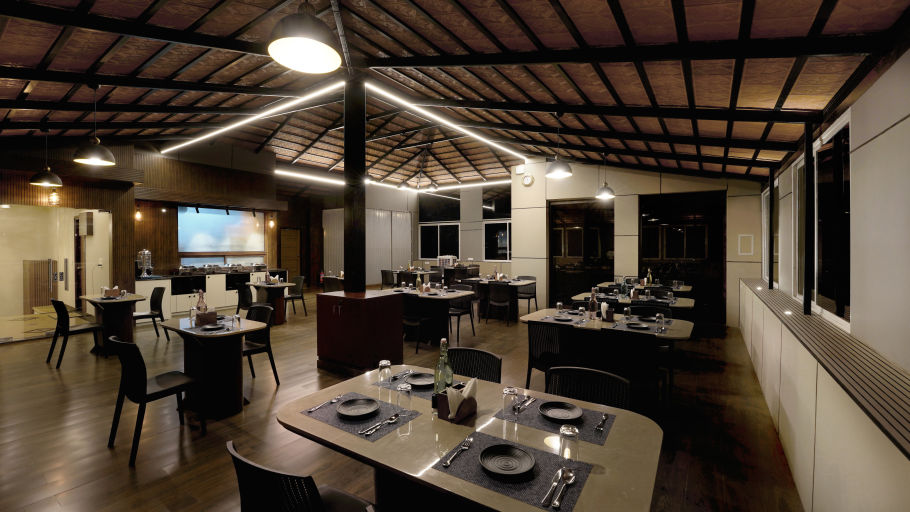  the indoor seating space at the restaurant 1 - the twin room offering twin beds with bedside lights facing the TV - Hotel Gwen by Rivido, Near Bannerghatta Road 3