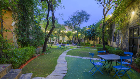 Hill Fort Kesroli 14th Century Alwar - view of a passage with grass and trees on either sides