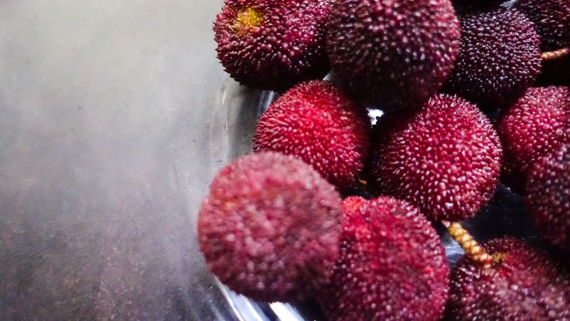 bowl of dark red fruit