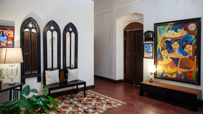 Beautiful lobby area with plants and painting @ Lamrin Ucassaim Hotel, Goa