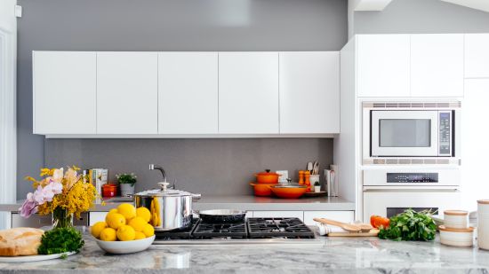 a kitchen with various vegetables and modern equipment