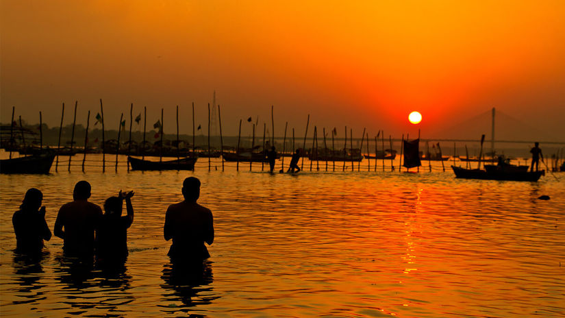 Hotel Polo Max, Allahabad - silhouette of people taking a dip in a river