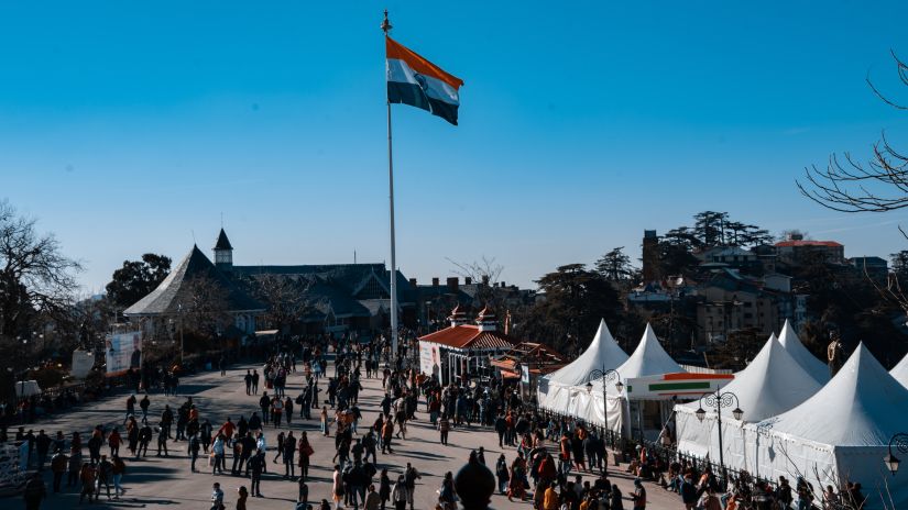 Large open space in Shimla with an Indian flag on a pole