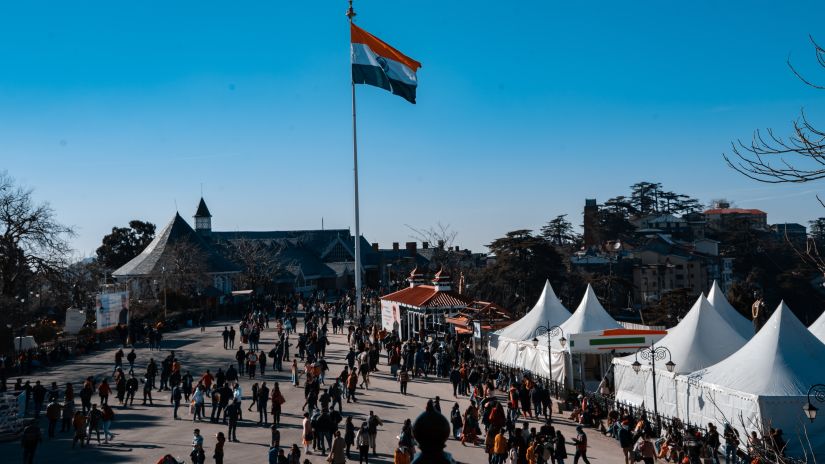 Large open space in Shimla with an Indian flag on a pole