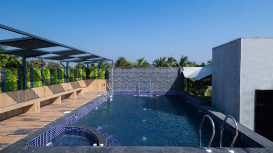 A full view of the swimming  pool during the day | Renest Calangute, Goa